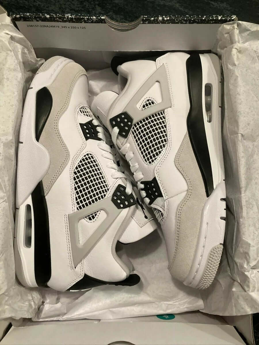 White and black Jordan 4 Retro size 38-45 available in Ghana - sneaker Daisy 